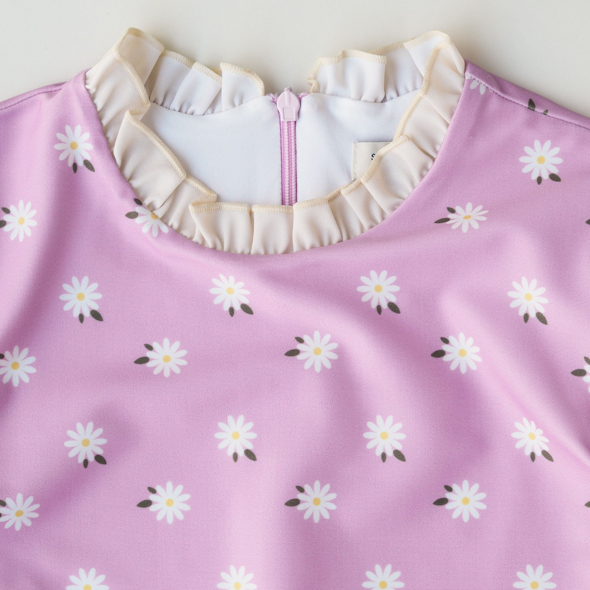 Meisje UV Badpak Ruffle Florence - lila met madeliefjes
